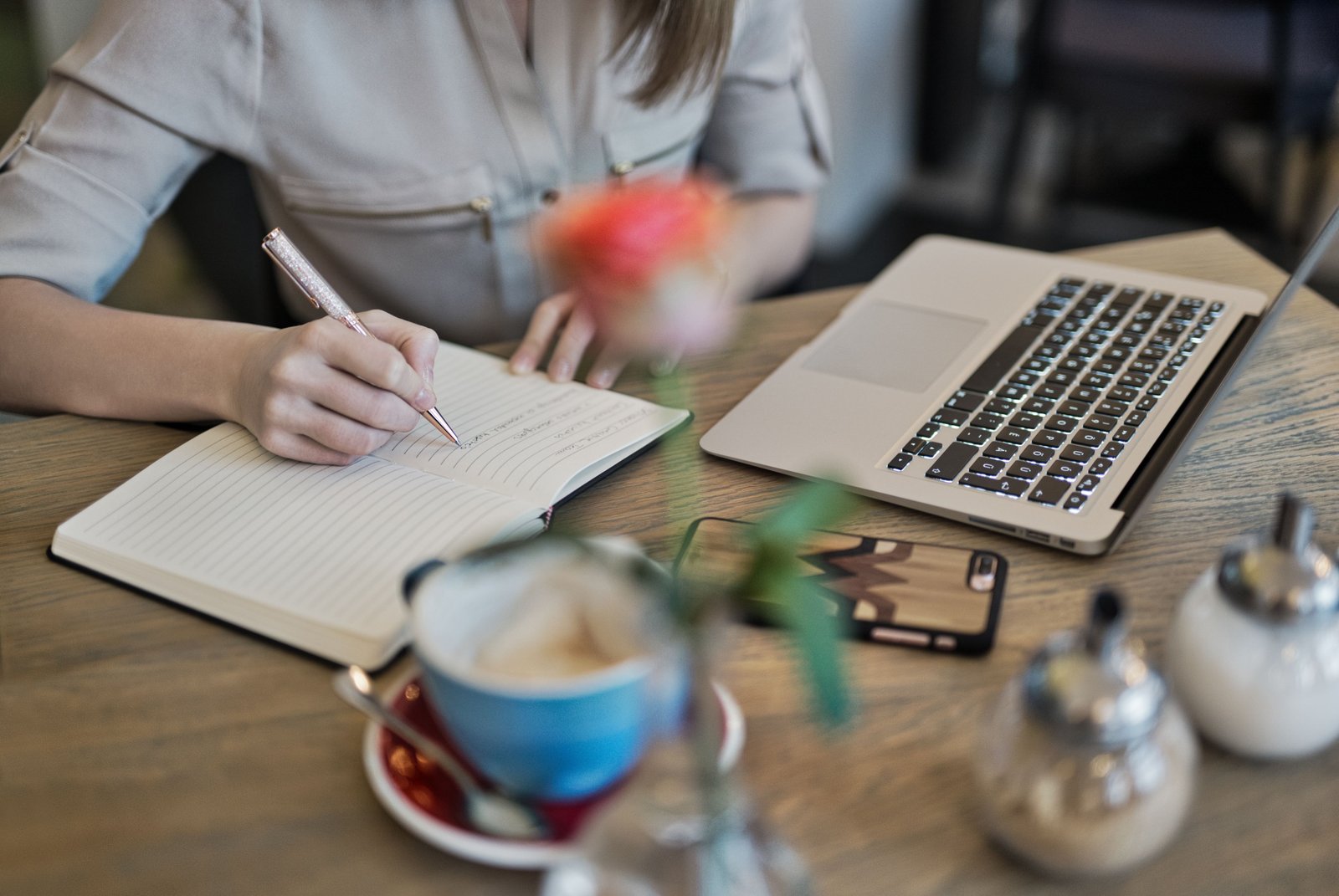 Marketer drafting content at a desk with coffee